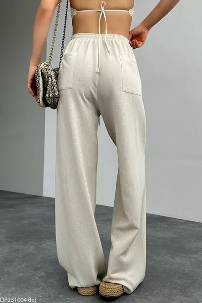 بنطال كتان نسائي بيج بحزام خلفي مزدوج الجيوب