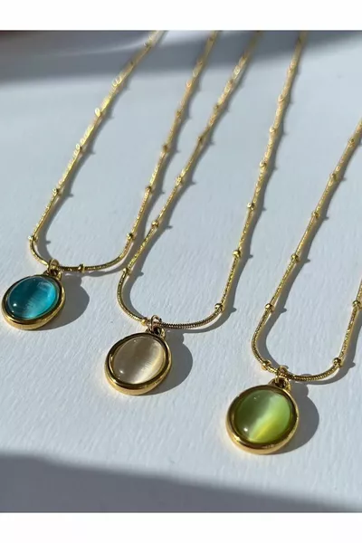 قلادة بحجر القمر البيضاوي والفولاذ