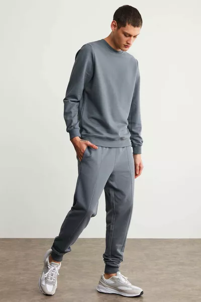 سروال رياضي رجالي فابيان، قصّة عادية، أمامه محبّب وحبال، من قماش ثلاثي الخيوط مبطن بالفراء، باللون الرمادي