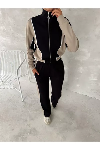 طقم رياضي نسائي عصري، ياقة عالية بسحاب، أرجل واسعة مع خطوط جانبية، موديل Aysho