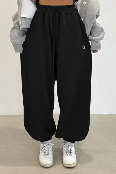 بنطال رياضي نسائي فضفاض من قطعتين باللون الأسود