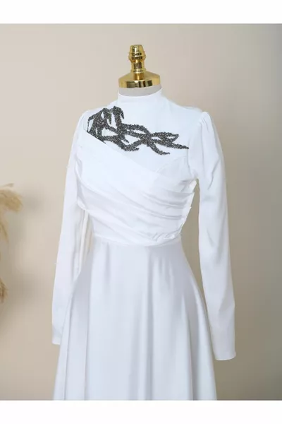 Evening dresses with stones on the collar and draped on the front