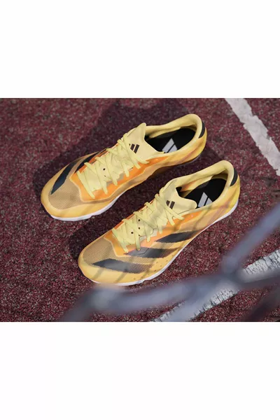 Distancestar Chaussures de course unisexes cloutées  Orange