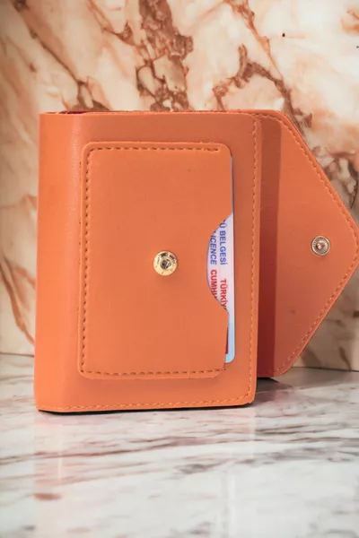 Женский мягкий кожаный стильный оранжевый держатель для карт с кнопкой и молнией