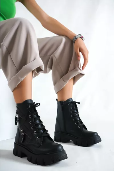 المرأة جلد أسود اثنين من سستة أحذية بريدية مقاومة للماء وحذاء 