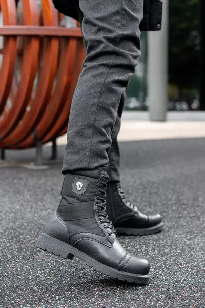 حذاء رجالي شتوي أسود مقاوم للماء والبرودة بسحّاب ونعال مطاطية مانعة للانزلاق مضمون