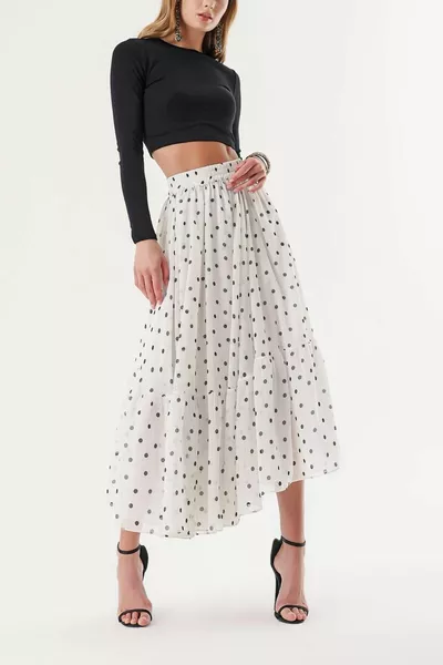 Lange rok met geplooide taille en stippen 