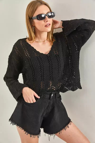 المرأة المخرمة منقوشة بلوزة متماسكة