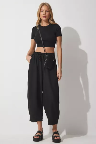 Pantaloni larghi da donna in viscosa con tasca nera vivida 