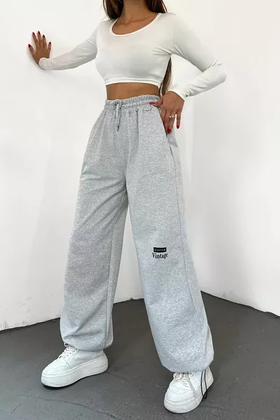 بنطال رياضي واسع للنساء بلون رمادي، بحبل مرن عند الخصر وقصة أرجل واسعة