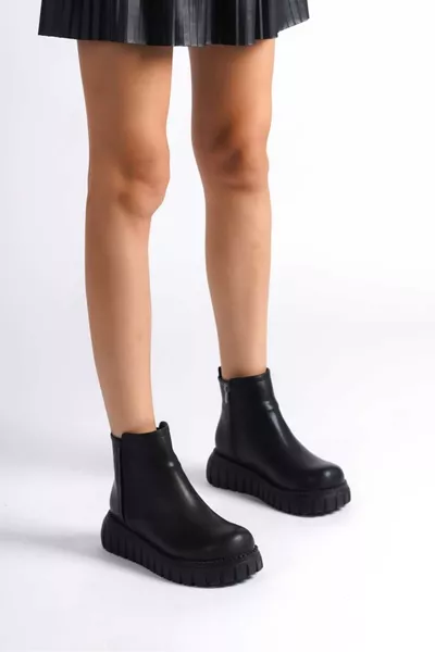 حذاء نسائي أسود من الجلد الصناعي مع سحاب ومرن