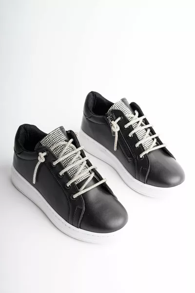 Schwarze Mädchenschuhe mit seitlichem Reißverschluss und Zungenstein