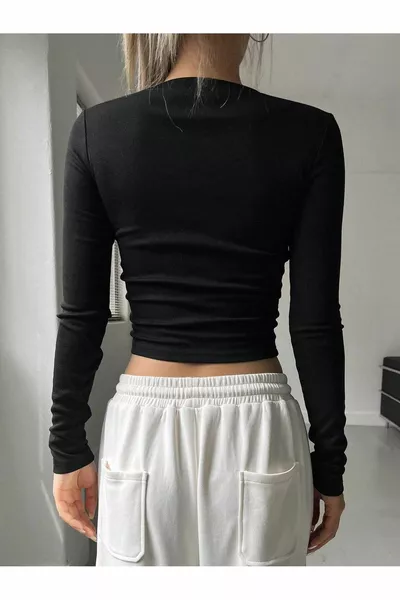 Camicetta corta a coste a maniche lunghe con girocollo stampato nero da donna