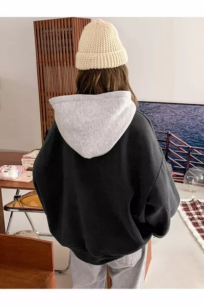 سويت شيرت واسع أسود بطباعة Suppose بثلاث طبقات للنساء