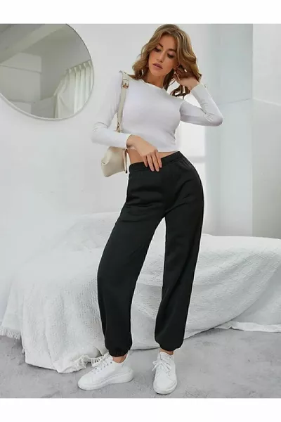 Pantalon de survêtement noir pour femme avec taille élastiquée et poches sur les jambes