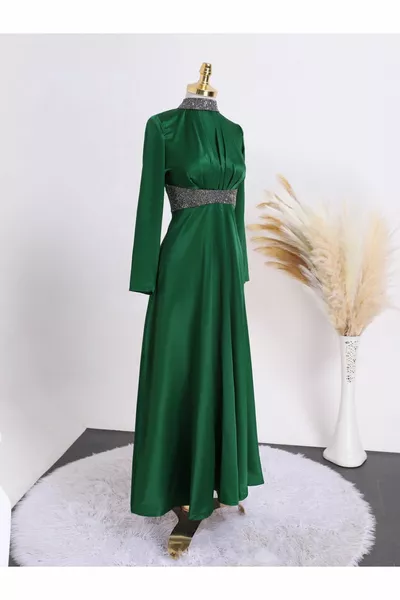 Satin evening dress with stone detail at the collar and waist