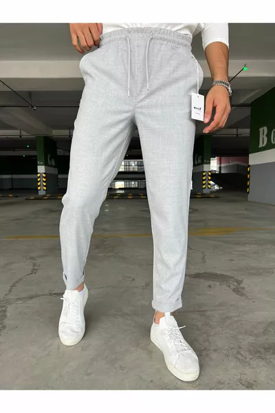 بنطال رجالي رمادي فاتح قابل للتمدد بحزام مطاطي مربوط وجيوب مزدوجة عند الكاحل