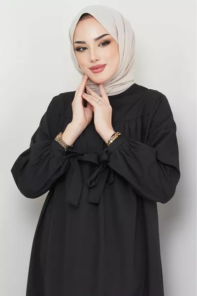 Jurk met jukmouwen en stropdas zwart