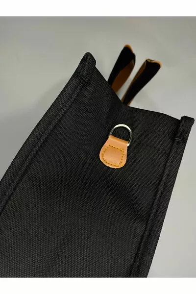 Zwarte draagtas voor dames, schoudertas met canvas vakken