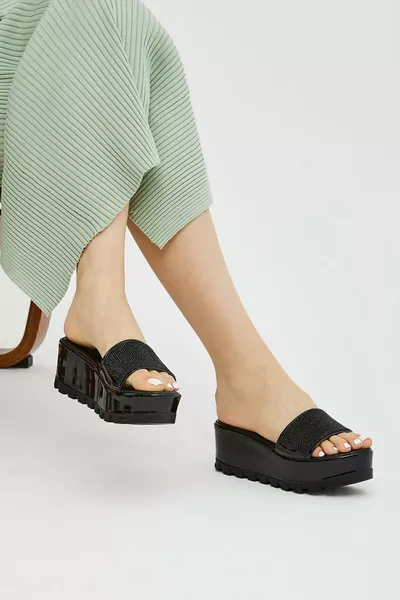 Mule femme à talon compensé plat avec pierres noires