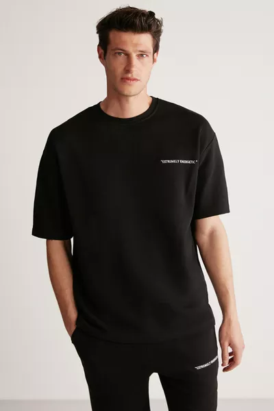 طقم رجالي كولومبيا مكون من قطعتين، قصة مريحة، مطرز بالكتابة، بدون شاردون باللون الأسود