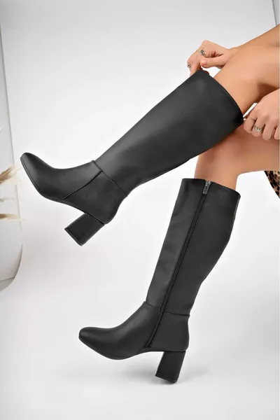 Zwarte knielaarzen met ritssluiting en hoge hakken voor dames