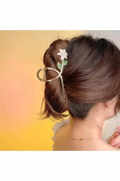 Pince à ressort en métal doré avec fleurs de lys blanches 