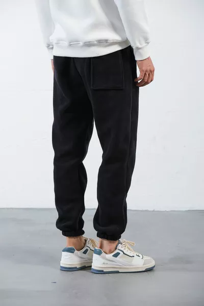 سروال رياضي رجالي فضفاض من قماش الفلانل الأسود