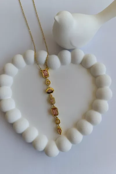 Collana a Y da donna in acciaio con design geometrico e pietre zircone rosa baguette