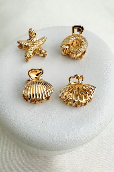 مشبك معدني صغير شكل صدف النجوم (المقاس: 2 سم)