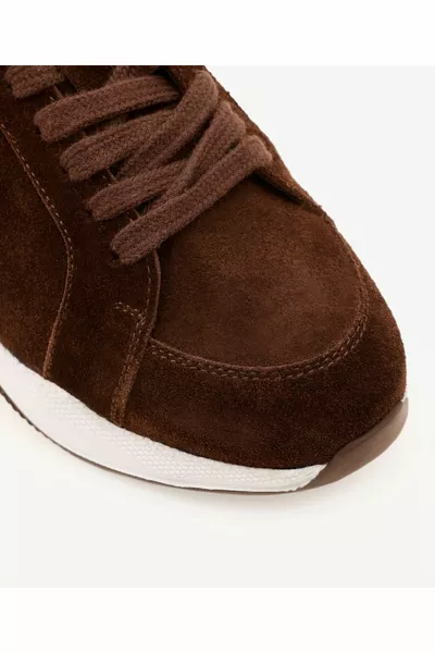 Leren sneakers met Thaise veren en details