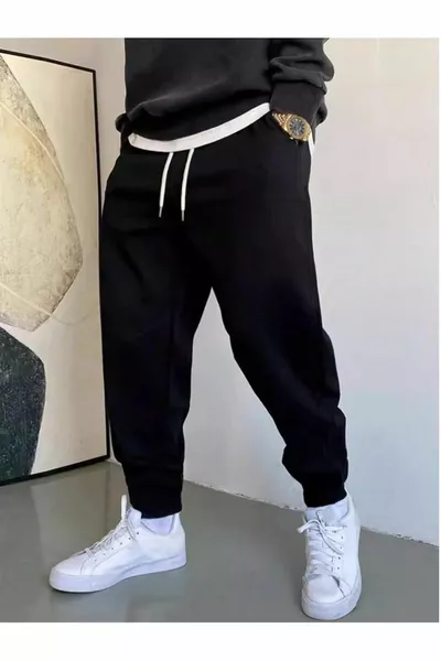 Pantaloni della tuta neri con fondo elastico, vestibilità regolare unisex