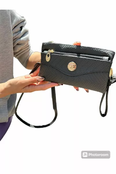 حقيبة نسائية سوداء يرتديها المعصم