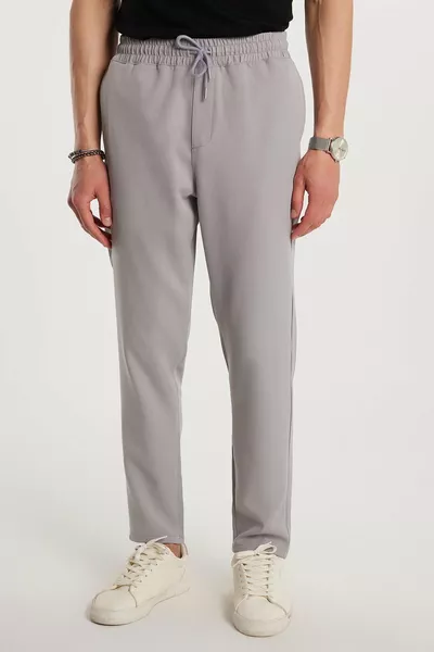 Pantalon de jogging gris pour homme, taille élastique avec cordon, coupe régulière, poches latérales, confortable