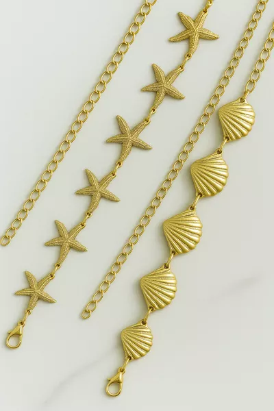 حزام سلسلة للمرأة بتفاصيل الصدف والنجمة البحرية للجسم والخصر والفستان والبنطلون، قطعتان