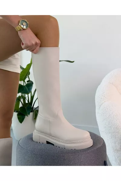 أول حذاء نسائي شتوي طويل بسحّاب بلون البيج مقاوم للماء