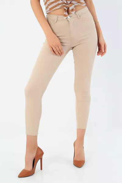 Jeans skinny crema a vita alta da donna che avvolgono i jeans a vita alta in lycra extra slim