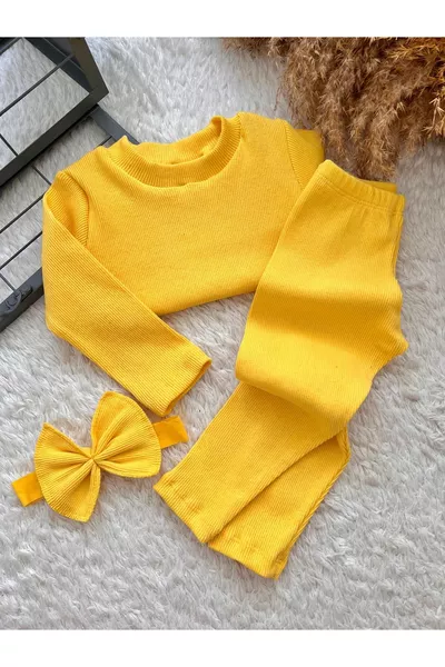 طقم رضيع أصفر: بنطال ضيق، بلوزة، وربطة رأس