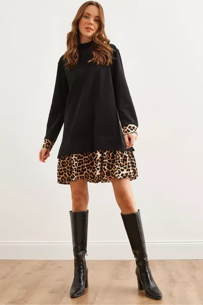 Damenkleid aus Spitzenstoff mit schwarzem Leopardenbesatz 