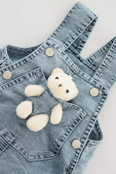 Salopette en jean pour bébé avec ourson en peluche