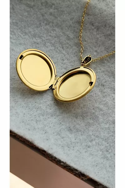 Collana con foto in acciaio con copertura apribile, si può incidere il nome, non si ossida