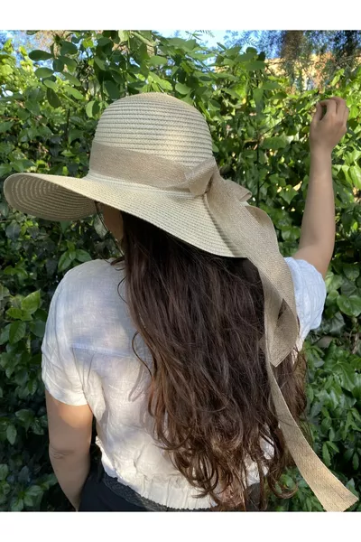 Beige straw cloche hat with a scarf