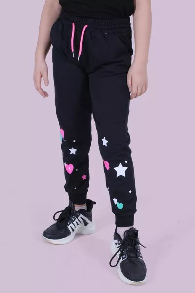 Pantaloni della tuta neri per bambina con dettagli a cuore e stelle