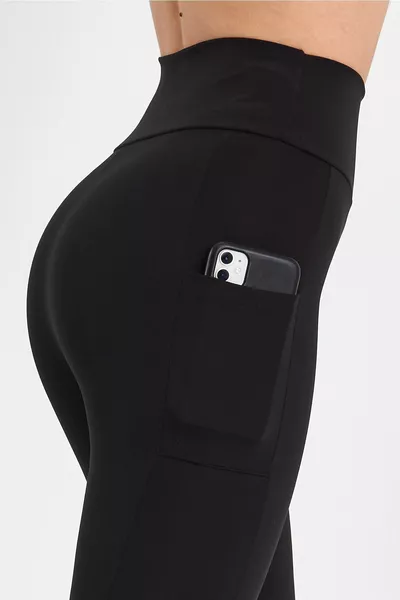 Zwarte sportlegging met hoge taille voor dames met liftende en verstevigende zakken