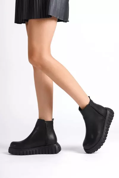 حذاء نسائي أسود من الجلد الصناعي مع سحاب ومرن