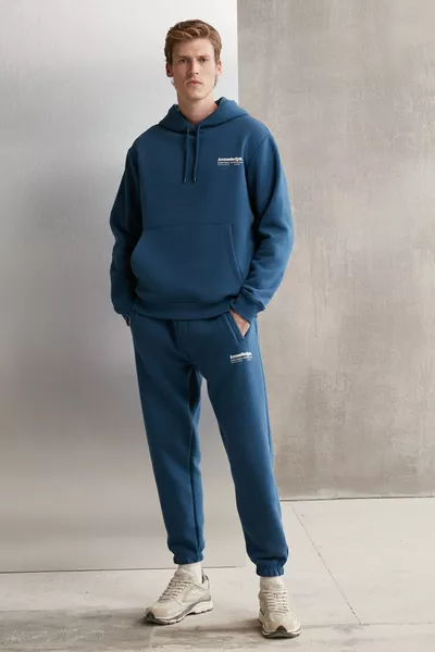 بنطلون رياضي رجالي أزرق من القطن العضوي، ناعم جدًا، بسحاب مطاطي، بقصة ضيقة عند الكاحل وثلاث جيوب